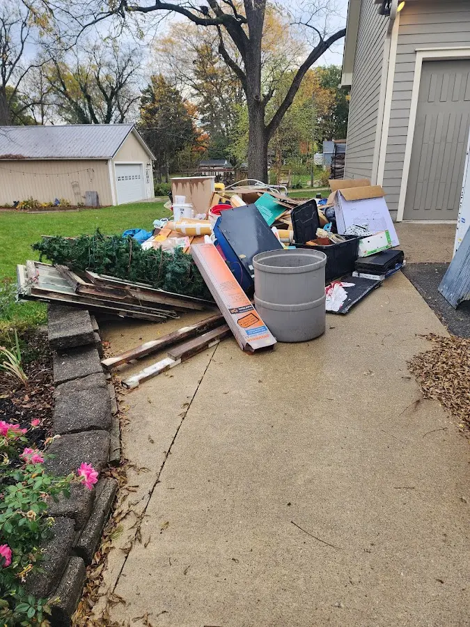 Dumpster being loaded with debris for Residential Dumpster Rental in Lancaster